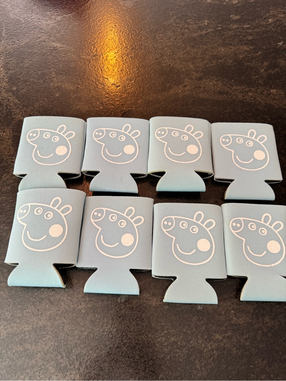 8 light blue and white Peppa Pig Koozies